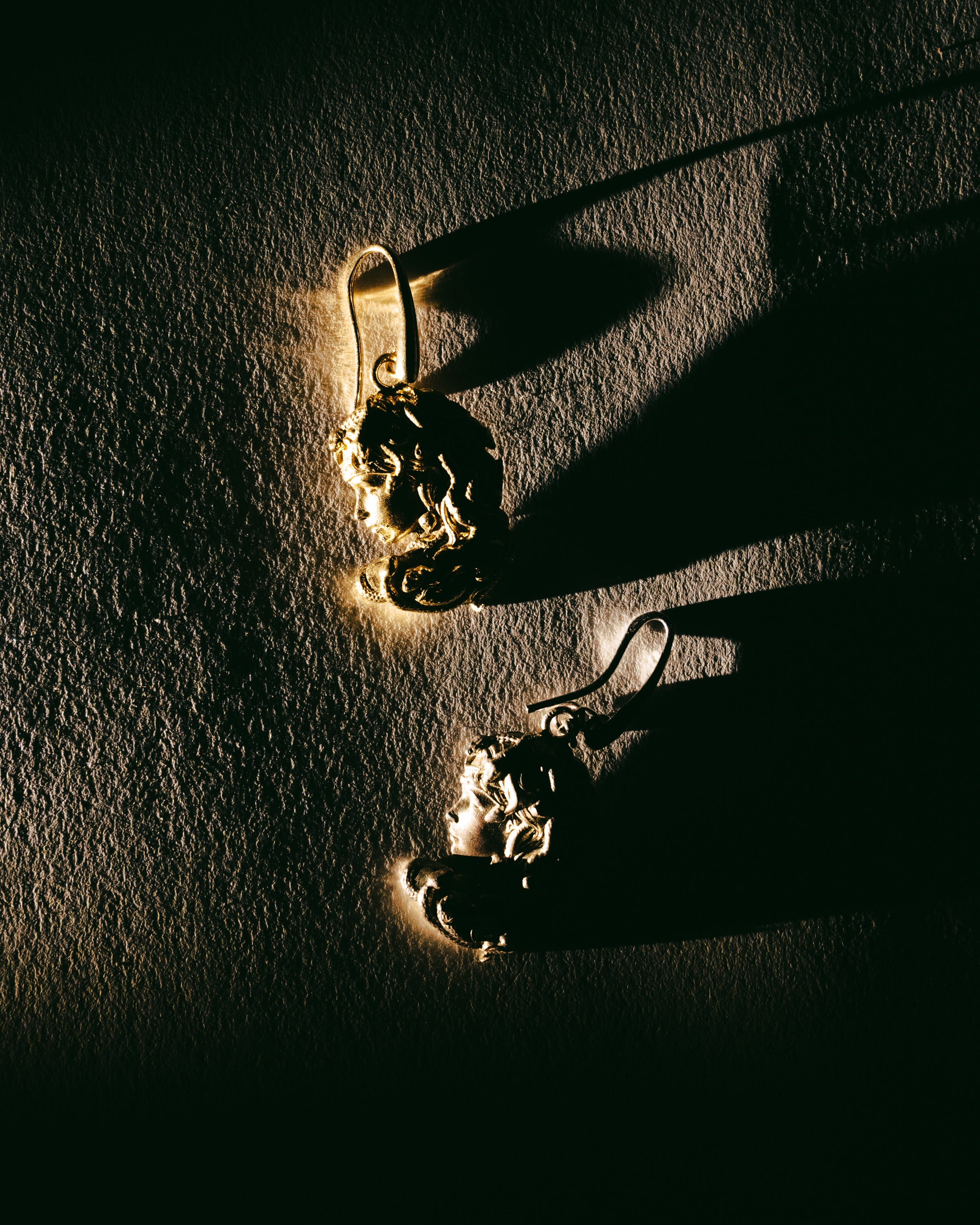 Medusa’s profile earrings