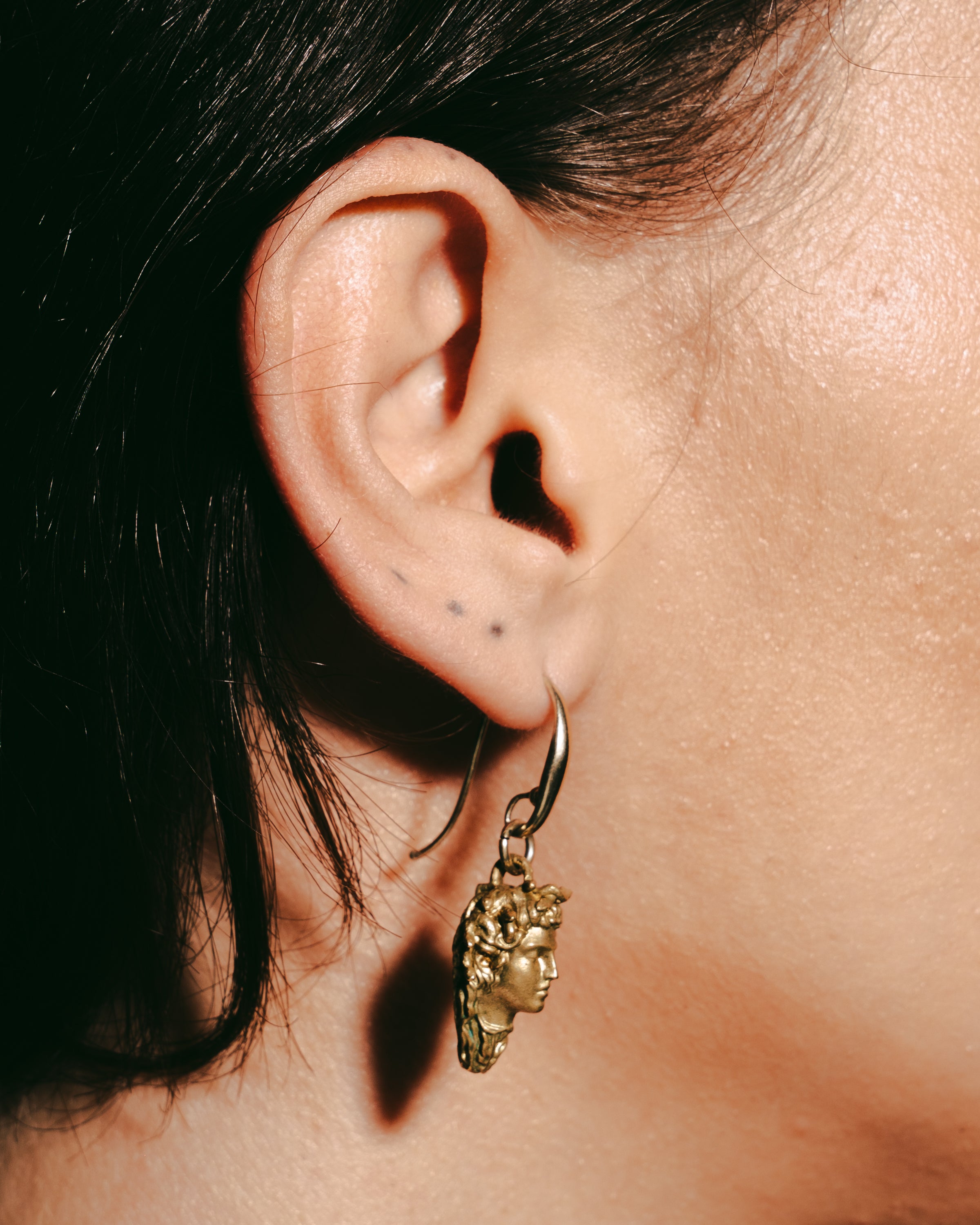 Cellini’s head earrings