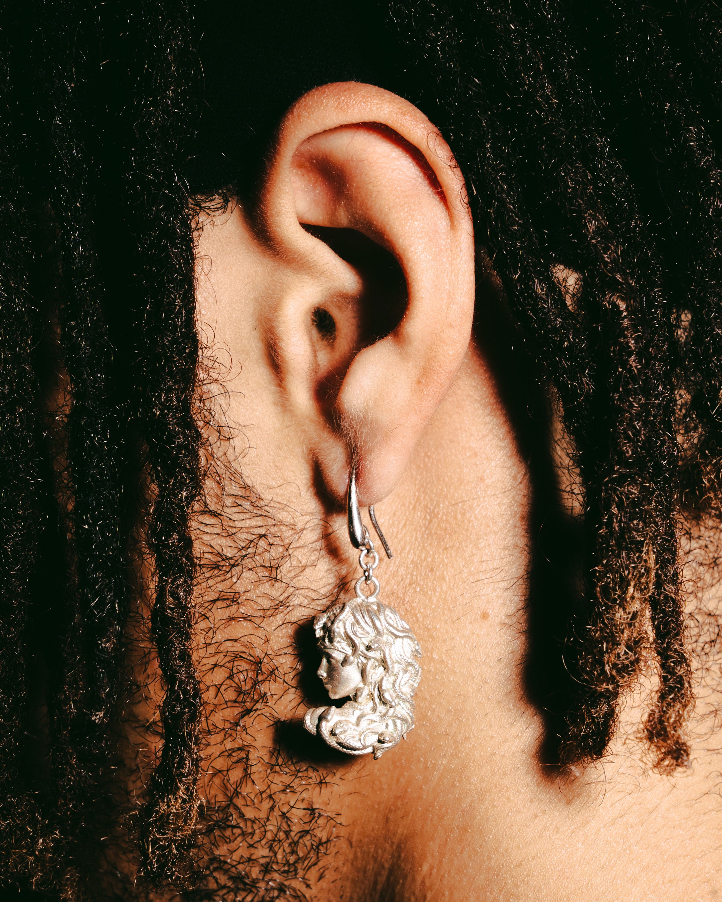 Medusa’s profile earrings
